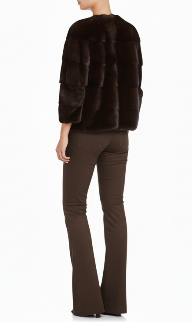 Person wearing a brown mink fur coat from lilly e violetta and matching pants on a white background